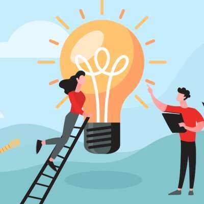 People working together to build a lightbulb.